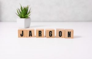 Wooden blocks on a table spelling out the word "jargon"