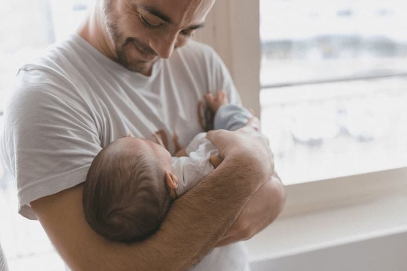 Dad holding baby