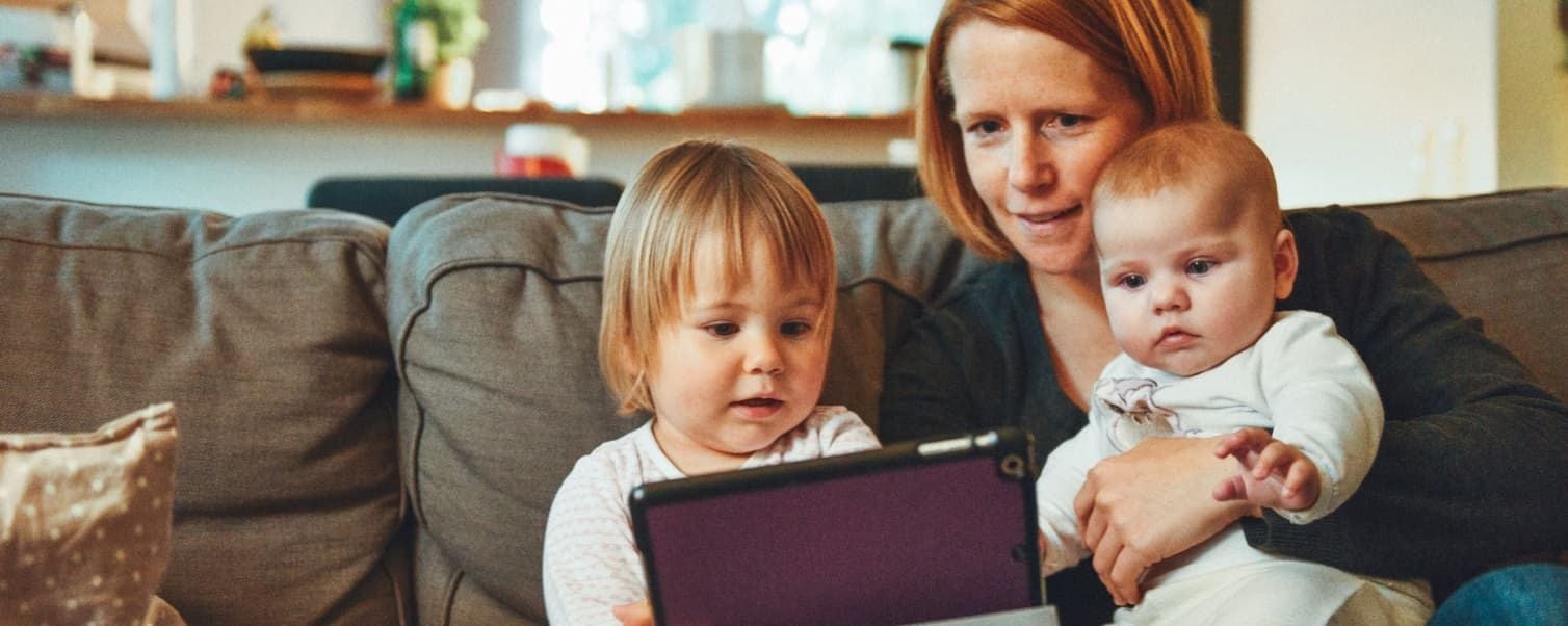 Mother with children using tablet